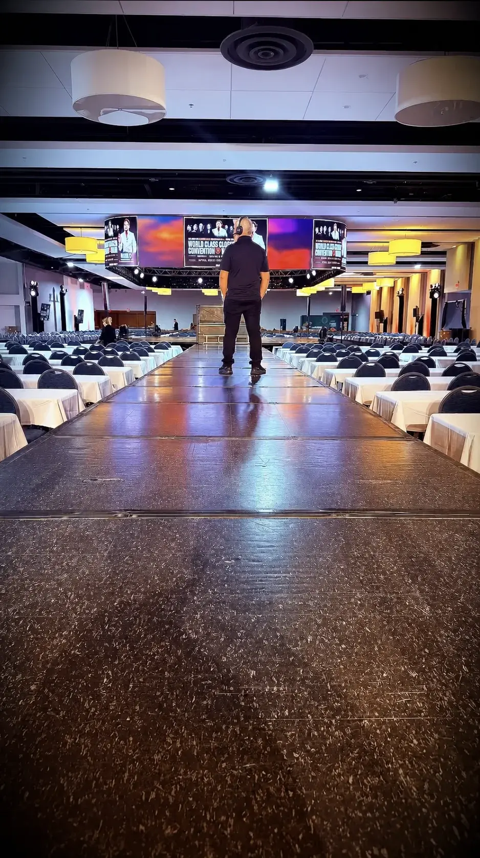 Experienced BE Productions operator inspecting a prepared event stage before showtime